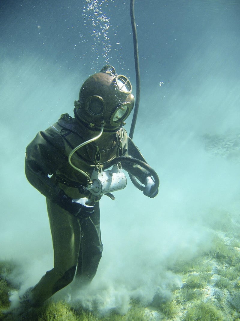 Diver Exploring Underwater Cave